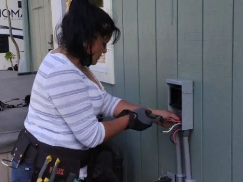 Licensed electrician wiring an exterior subpanel in Corydon